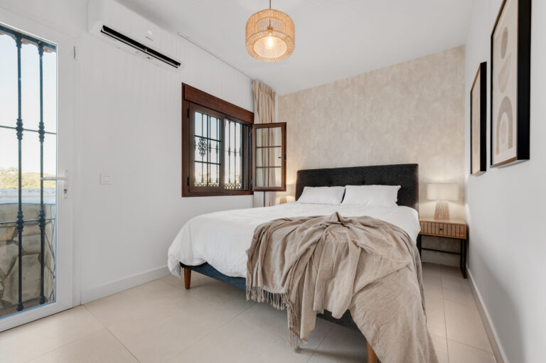 Ground-floor bedroom with fitted wardrobe and garden door