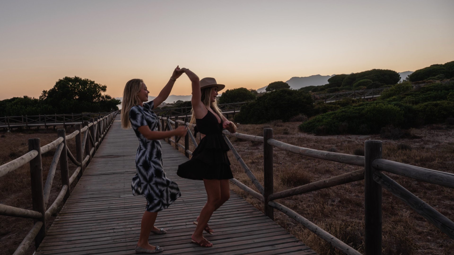 Sunset on the boardwalk through the Dunas de Artola near Casa Cabopino Retreat in Cabopino, Marbella East